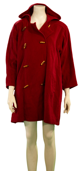 Stylish red hooded coat with toggles on mannequin.