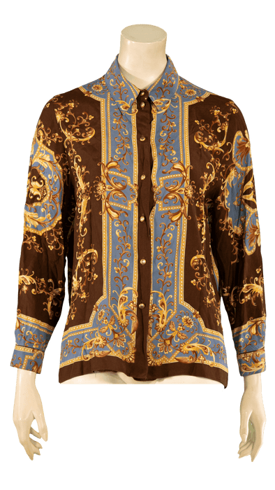 Elegant brown and blue button-up shirt with ornate gold patterns displayed on a mannequin.