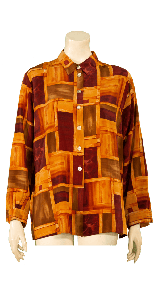 Retro patterned button-up shirt in shades of yellow, orange, and red on a mannequin.