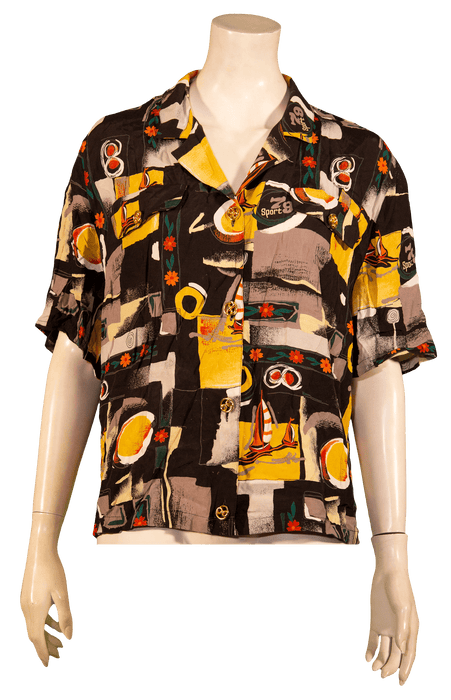 Vibrant abstract print short-sleeve shirt displayed on a mannequin.