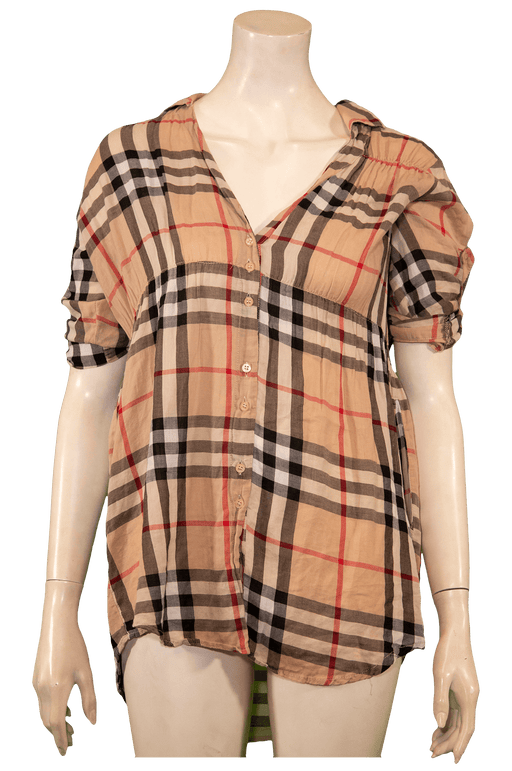 Stylish plaid button-up shirt with rolled sleeves on a mannequin, perfect for casual wear.