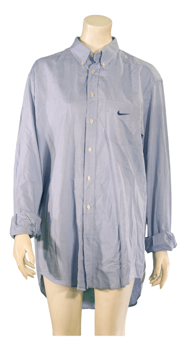 Blue long-sleeve button-up shirt on a mannequin featuring a small logo on the chest.