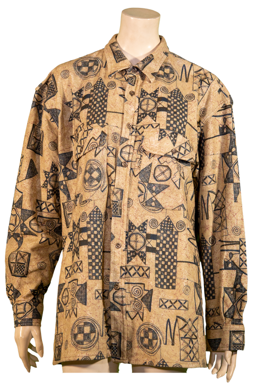 Beige long-sleeve shirt with black tribal and geometric patterns displayed on a mannequin.