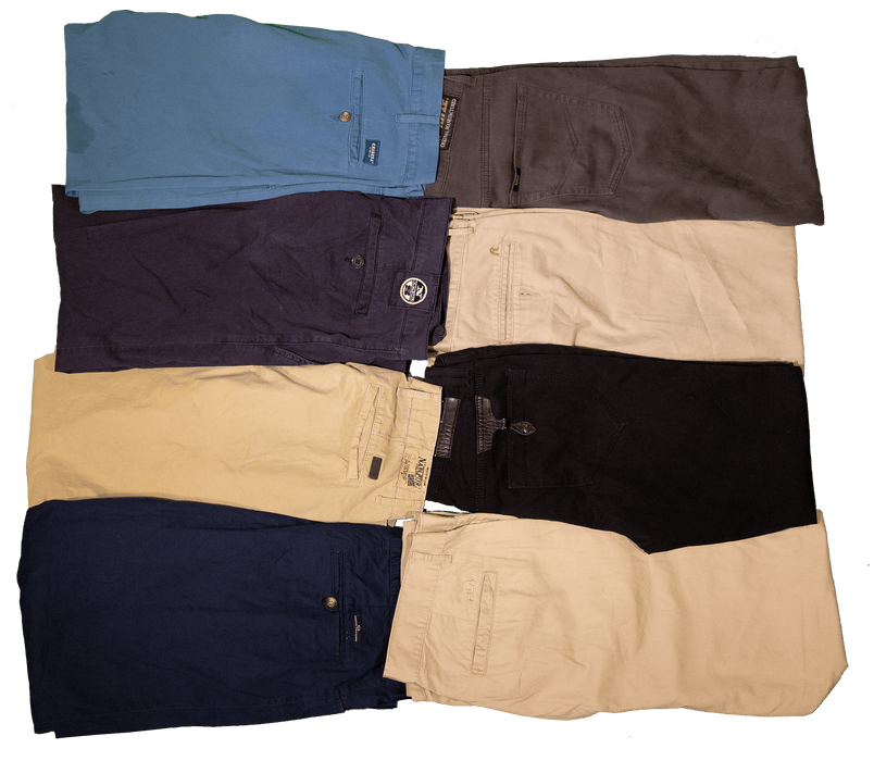 Various colored pairs of men's shorts folded and arranged neatly.