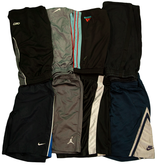 Assorted athletic shorts in various colors and brands arranged in a row.