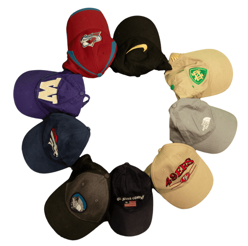 A variety of sports caps arranged in a circle, featuring team logos and popular brands.