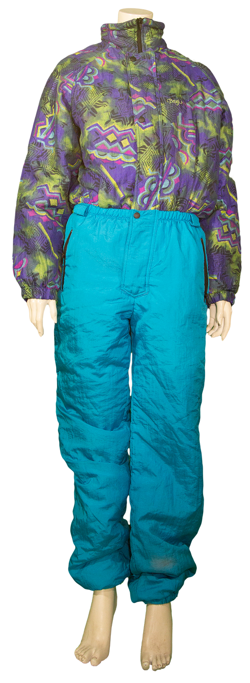 Vintage ski suit with vibrant purple and green patterned jacket and bright blue pants.