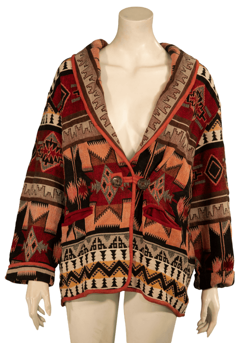 Stylish Native American-inspired cardigan with intricate red, black, and beige geometric patterns on a mannequin