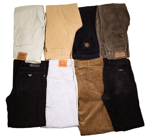 Various colors and styles of folded jeans and pants arranged on a flat surface