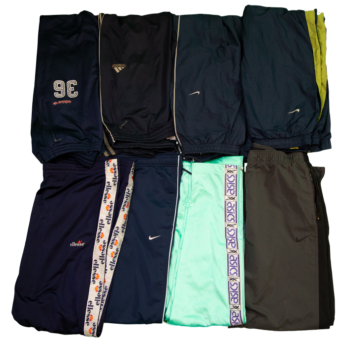 "Collection of sports pants in various colors and brands including Nike, Adidas, and Ellesse"