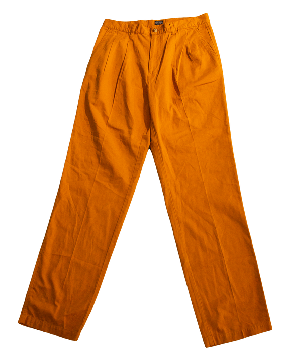 Bright orange tailored pants with a pleated front and a relaxed fit.