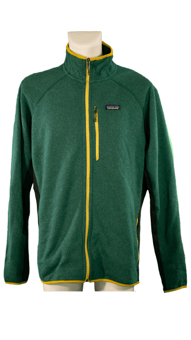 Green zip-up jacket with yellow accents on display mannequin, perfect for outdoor adventures and casual wear.