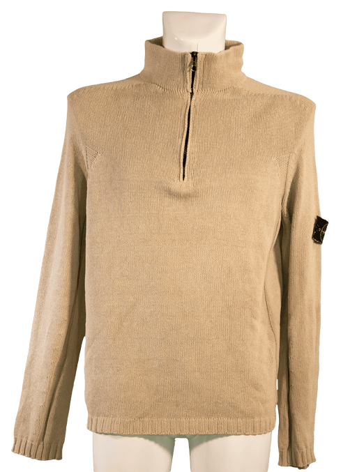 Beige zip-up wool sweater with high collar on a mannequin, showcasing casual and cozy winter apparel.