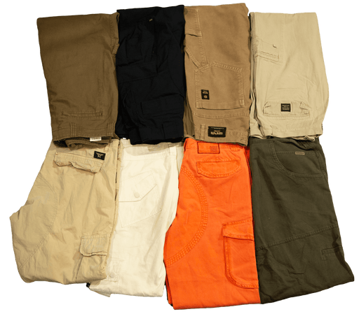 Various colors of cargo pants neatly folded in a display.