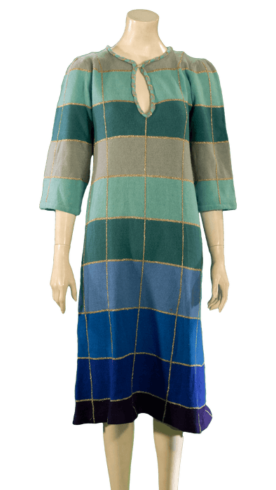 Womannequin displayed in a blue and green checkered dress with three-quarter sleeves featuring a keyhole neckline.