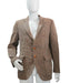 Brown tweed blazer with orange buttons on a mannequin