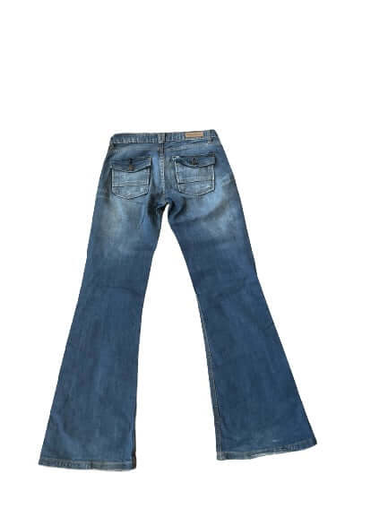 Back view of blue denim bootcut jeans with slight fading and classic pockets.