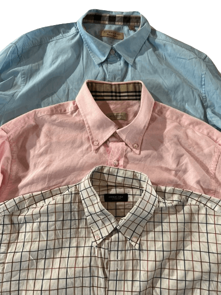 Vintage Wholesale Burberry shirts mix from 70s to 00s in blue, pink, and checkered patterns. Grade A vintage clothes for fashion lovers.