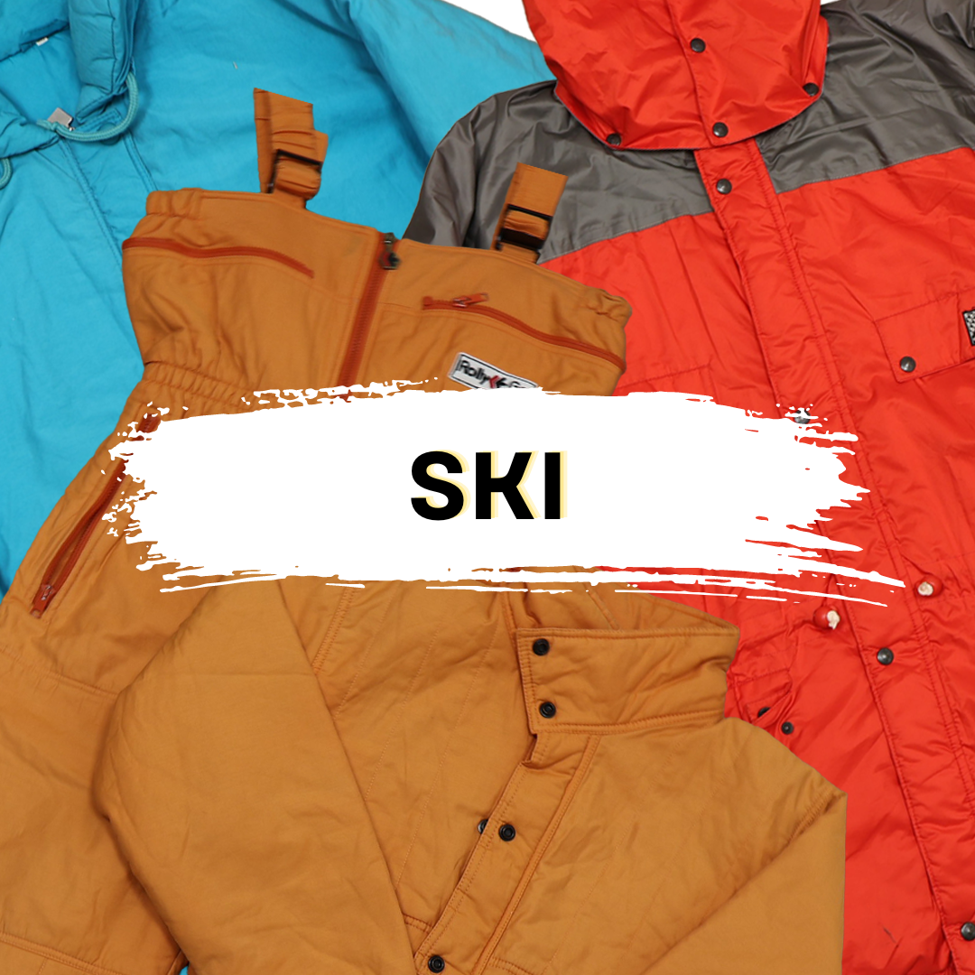 Vintage ski clothes collection, featuring retro orange overalls and colorful jackets. Perfect for vintage fashion and wholesale buyers.