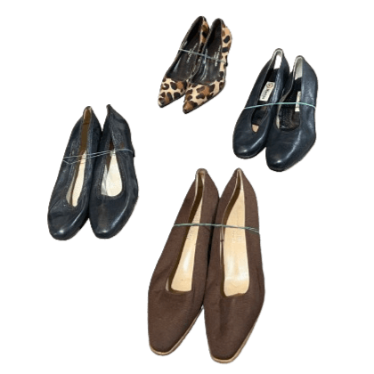 Collection of women's shoes featuring three pairs of black heels, one pair of brown flats, and one pair of leopard-print stilettos