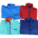 Vintage Patagonia fleeces mix from different eras in red, blue, and green, showcasing high-quality wholesale vintage fashion.