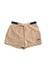 Beige women's shorts with blue waistband and red logo patch - casual and stylish summer attire.