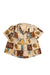 Short-sleeve button-up shirt with a colorful patchwork design featuring leaves and abstract patterns in earthy tones.