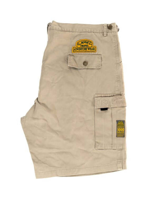 Khaki cargo shorts with pockets and adventure wear patches.